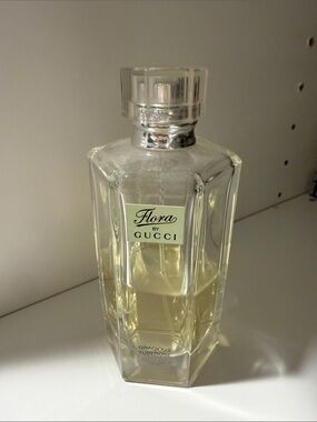 Gucci Flora Perfume Bottle with Pale Yellow Liquid